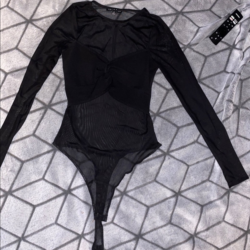 Black mesh bodysuit with long sleeve.